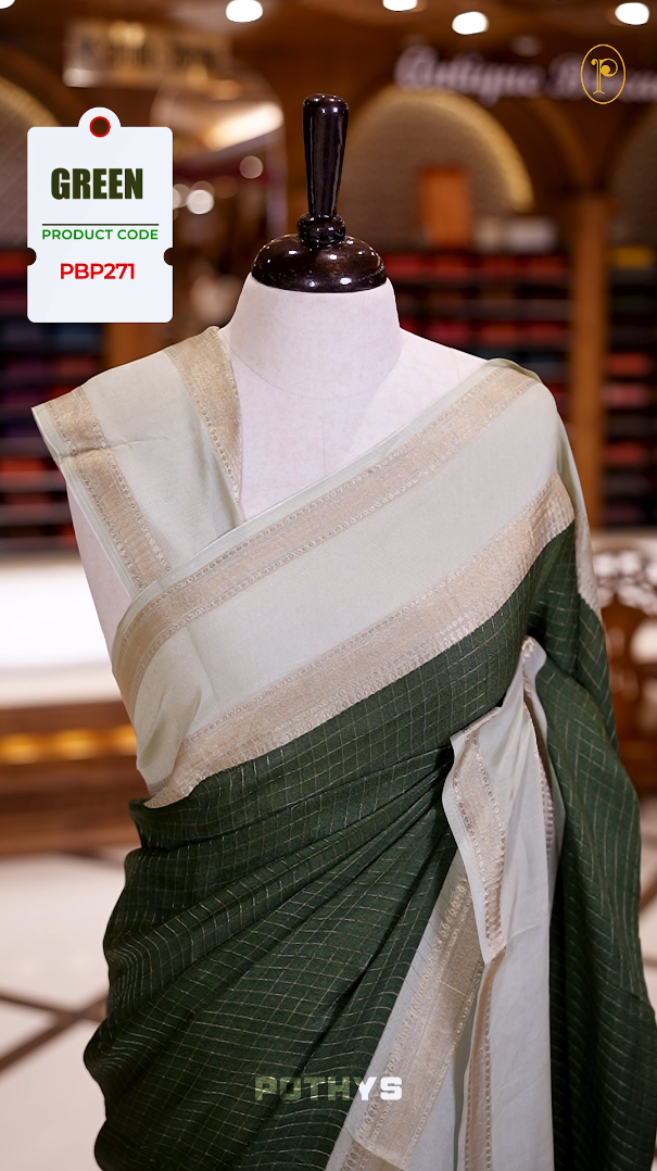 Deep Green colour saree featuring fine check patterns on the body, paired with a light Green zari woven border and pallu. Comes with a matching blouse piece