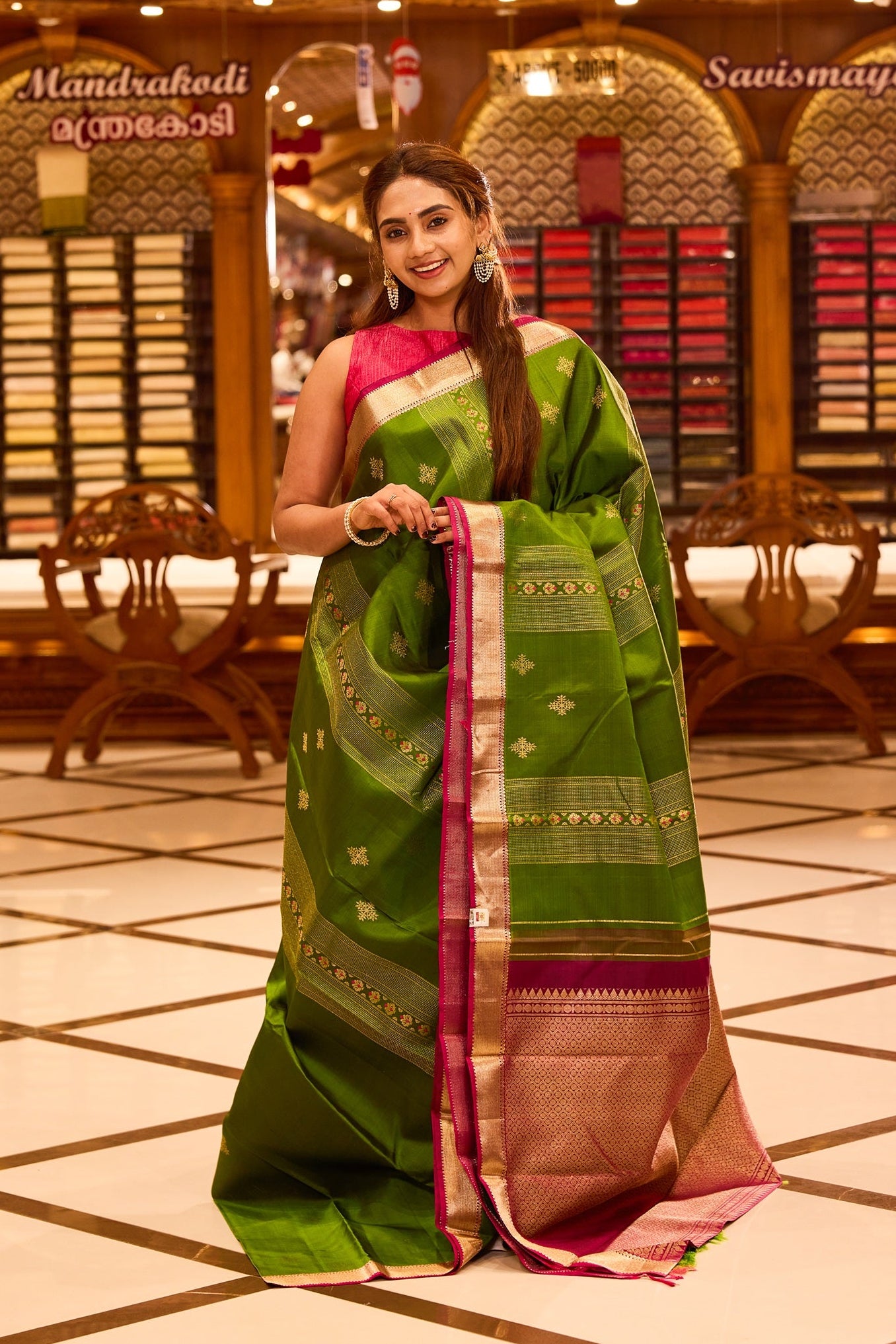 Vibrant parrot green colour Kancheepuram silk saree adorned with delicate gold zari motifs across the body, beautifully complemented by a classic zari border with hints of contrast, styled with a blouse