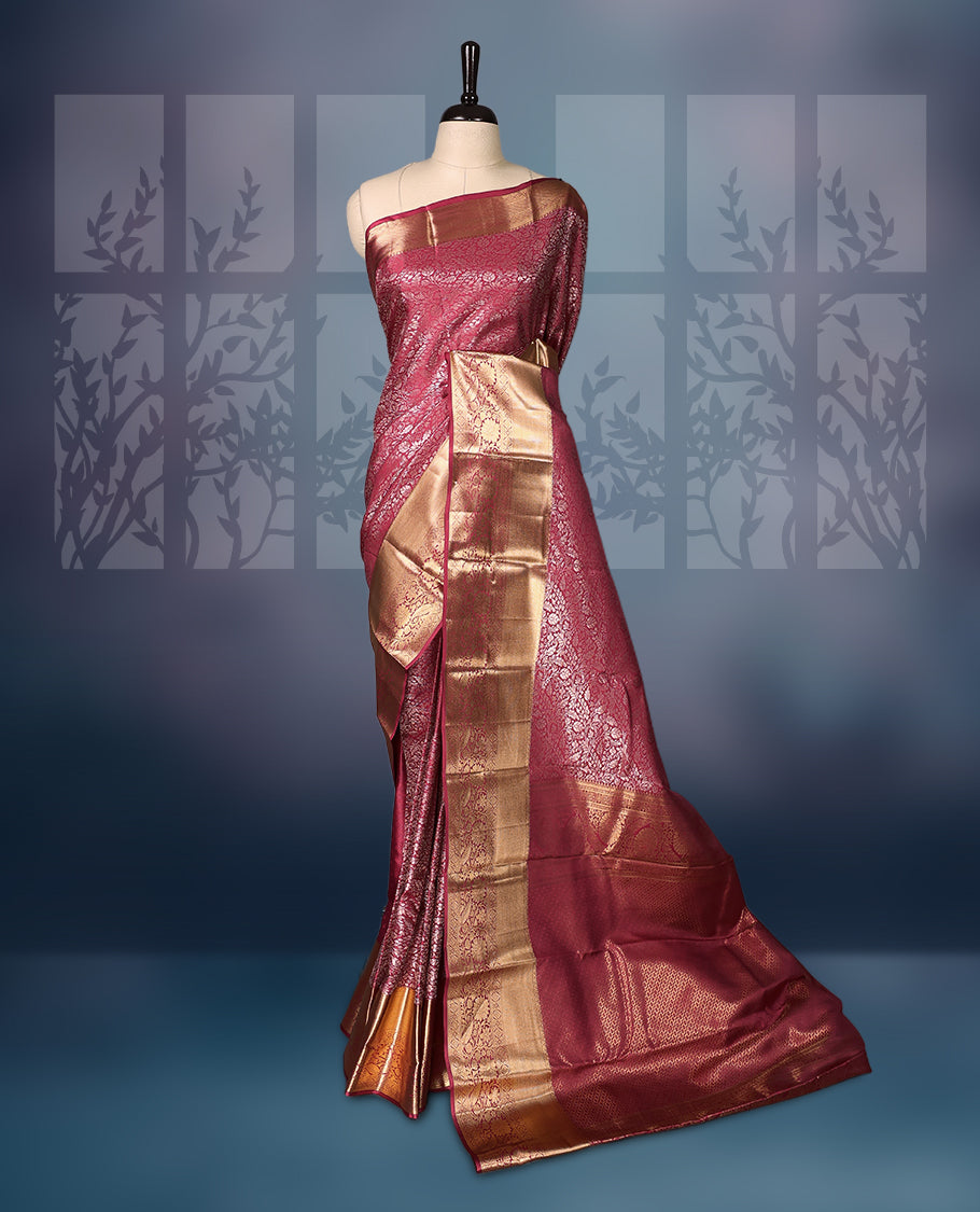 Deep pink semi silk brocade saree with intricate gold zari brocade work and a rich gold woven border and pallu, Comes with a matching blouse, perfect for festive occasions and traditional celebrations.