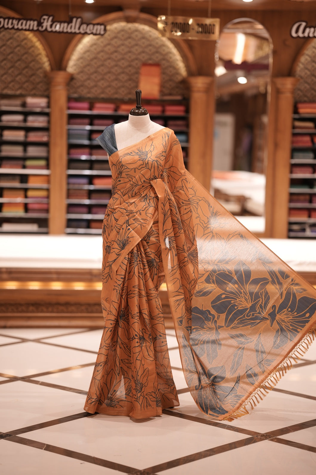 Mustard yellow & Blue colour Semi linen tissue saree featuring full digital floral prints across the body, The saree is highlighted with a contrast floral printed pallu and comes with a plain contrasting blouse piece.