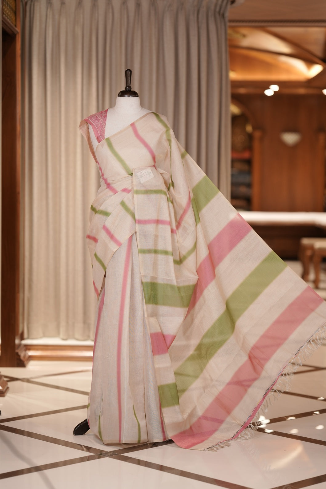 Pista green & Pink colour Linen printed saree featuring stylish fancy line prints all over, paired with a contrast colour printed blouse and a beautifully designed fancy line pallu.