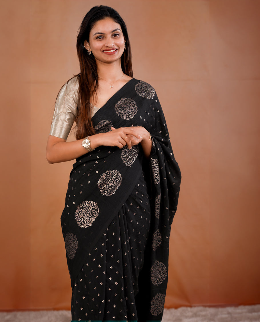Black colour vijithra silk saree featuring small zari details on body, Tree design border.