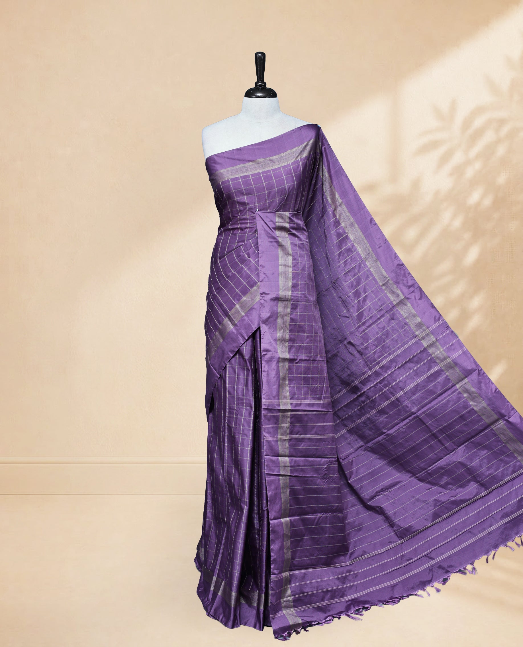 Lavender colour Semi Silk Saree Featuring Gold zari Big Checks on body, complemented by Contrast Border Detailing, comes with matching blouse piece.