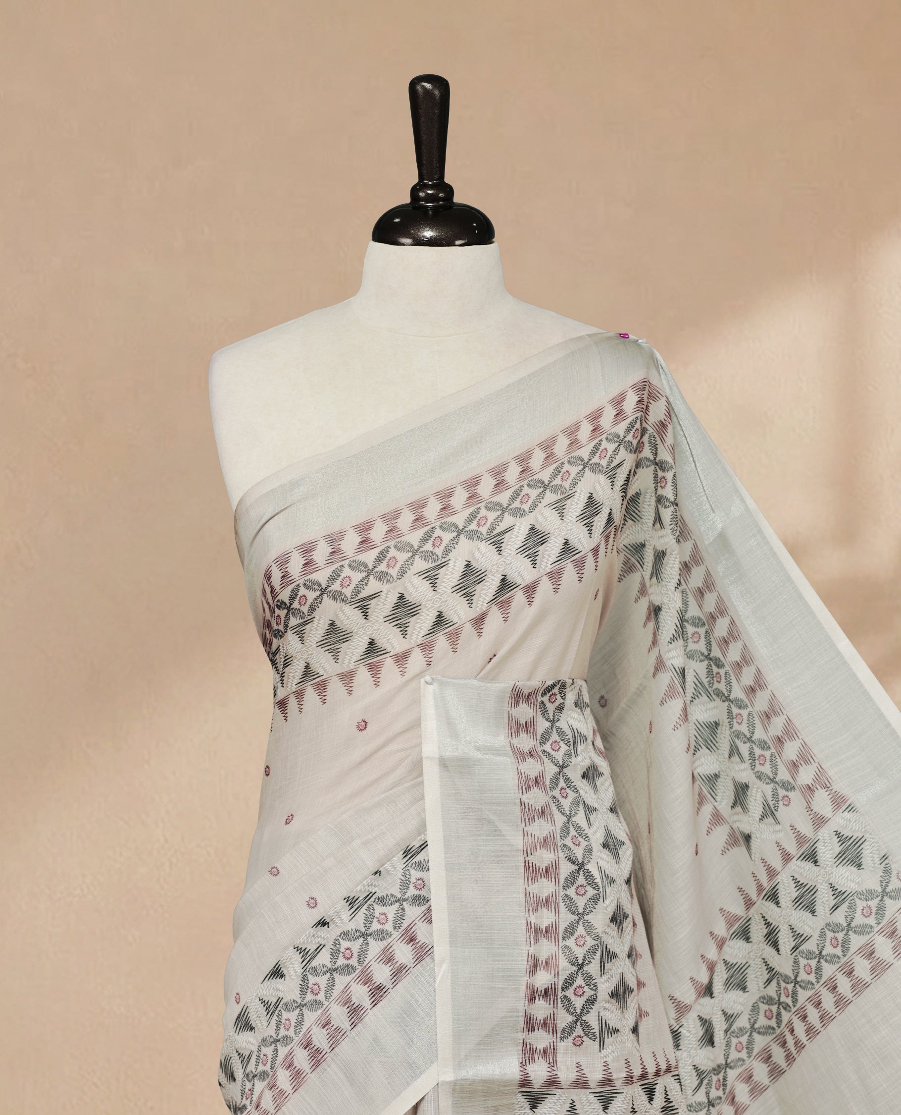Grey Colour Semi Linen colour saree featuring Thread buttas on body & border, paired with matching blouse piece thread worked border.