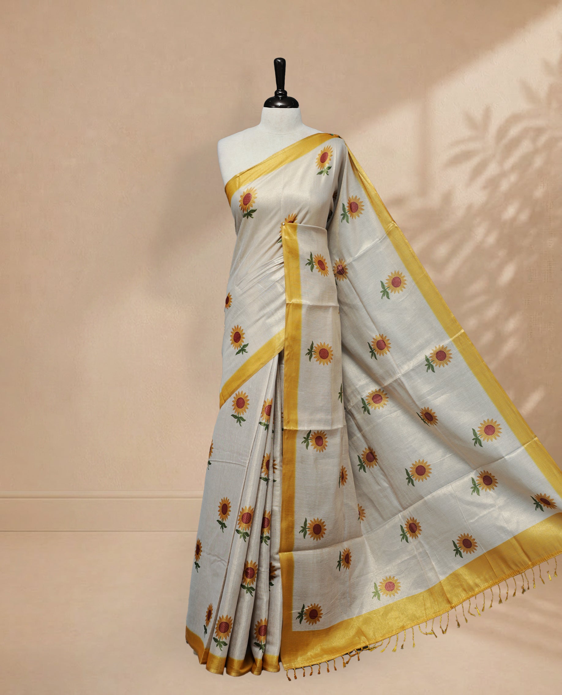 Butter Cream colour Linen Tissue Saree featuring Sunflower Print, small & Big floral print & contrast border, Comes with Contrast Self Printed Blouse.