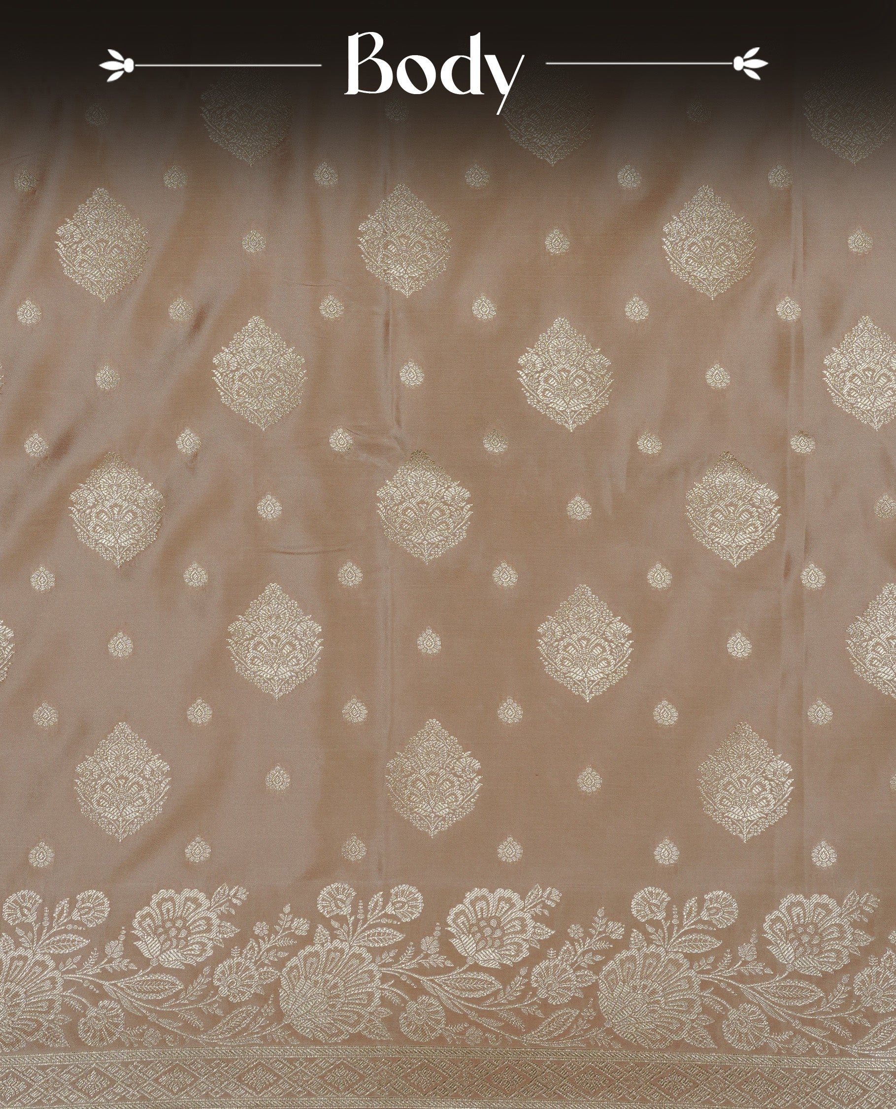 Muted Beige gold colour Mulberry silk saree featuring light gold small buttas & big motifs onbody, complemented by self colour with Light gold zari floral Border, comes with matching blouse piece.