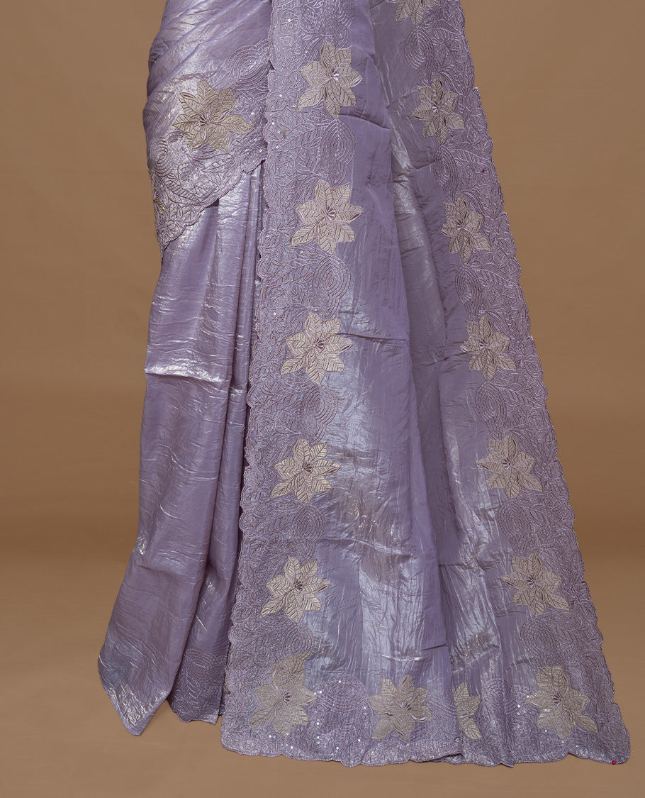 Pastel Purple colour Crush Organza Featuring Plain body, Enrich with Floral thread pattern with sequins & scalp border, paired with matching blouse piece.