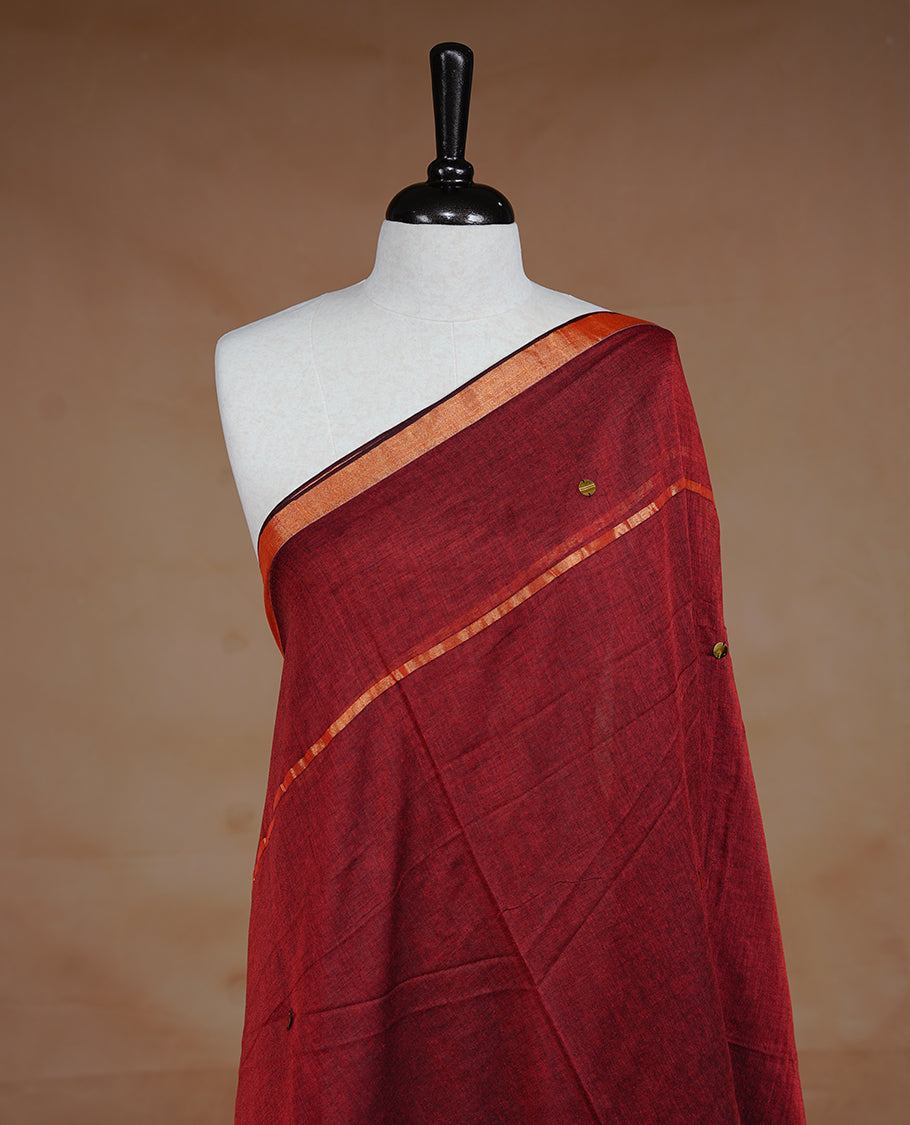 Maroon colour Mul Cotton saree featuring a plain body with sequin detailing, highlighted by a small gold colour border,without blouse piece.