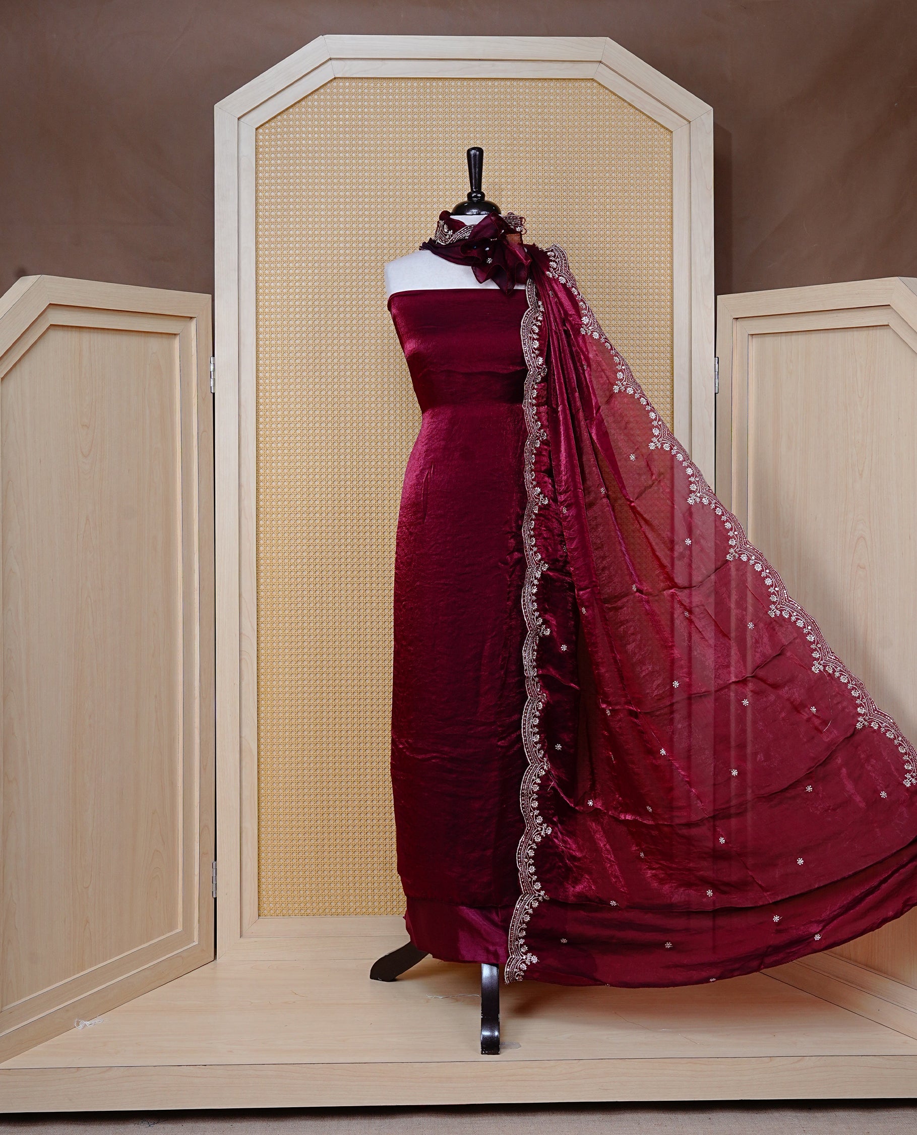 Maroon colour Fendy silk salwar material With Elegant plain body with lining, Comes with santoon bottom, Fendy silk dupatta With Floral buttas & Scalp Border.