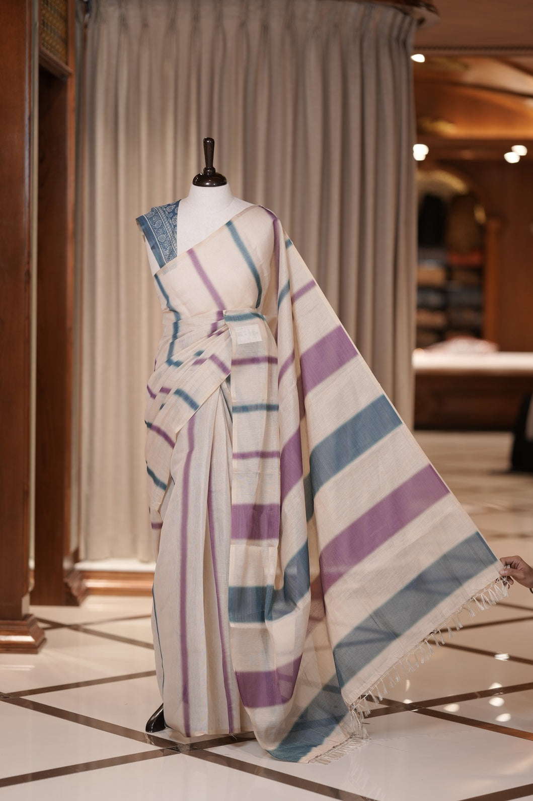 Teal blue & Violet colour Linen printed saree featuring stylish fancy line prints all over, paired with a contrast colour printed blouse and a beautifully designed fancy line pallu.