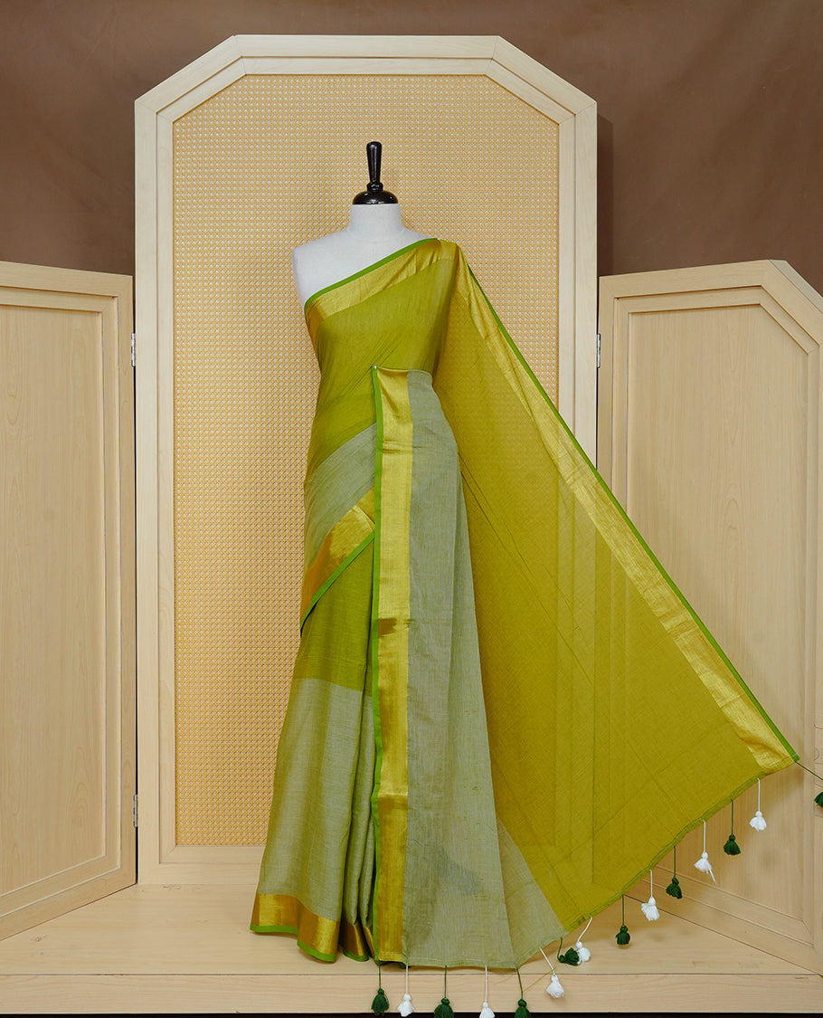 Parrot Green with Sage Green Dual colour Mul cotton saree featuring Half & Half Dual Tone Plain Body, Complemented by Gold tissue Border & pallu.