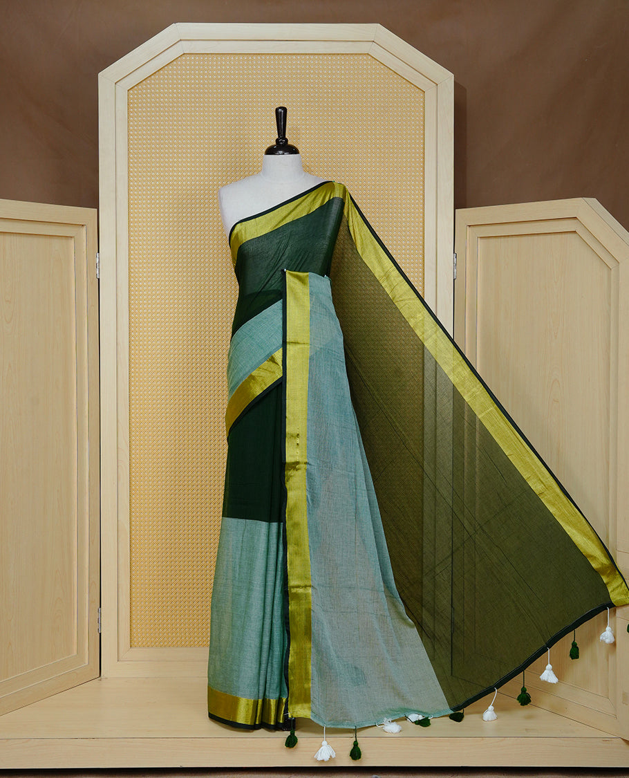 Dark Green with Mint Green Dual colour Mul cotton saree featuring Half & Half Dual Tone Plain Body, Complemented by Gold tissue Border & pallu.