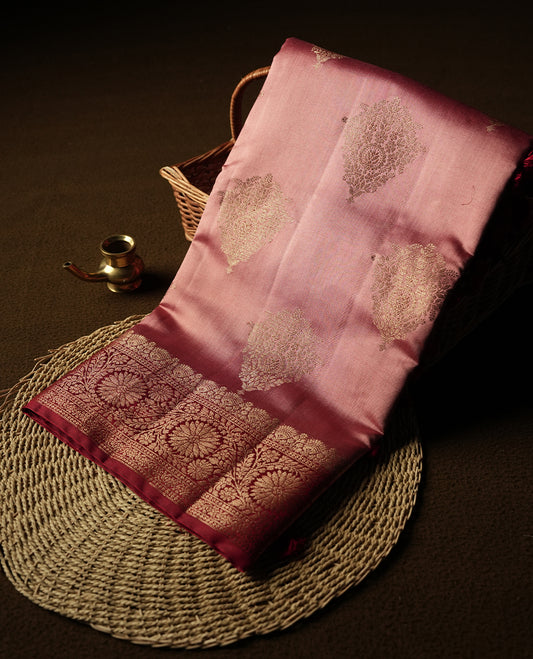Soft Pink Colour Banaras Soft Silk Saree with Gold Zari Rounded Diamond Buttas, Intricate Multi-Layered Floral Border, Grand Pallu with Intricate Floral Motifs in Deep Red and Gold Tones, and Matching Blouse.