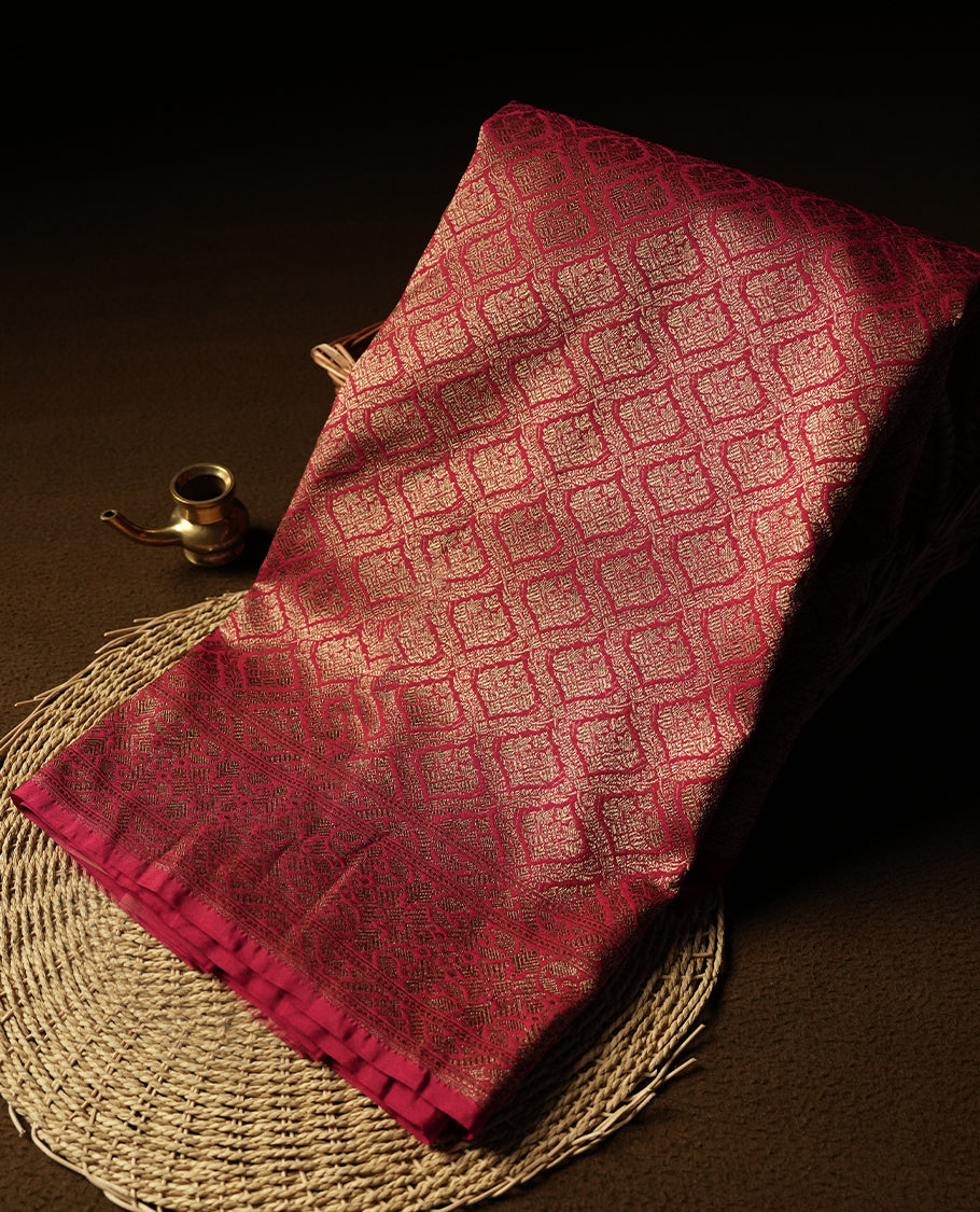 Maroon Colour Semi Banarasi Katan Silk Saree with Gold Zari Buti Motifs, Traditional Gold Floral Pallu, Elaborate Woven Border, Decorative Tassels with Matching Blouse