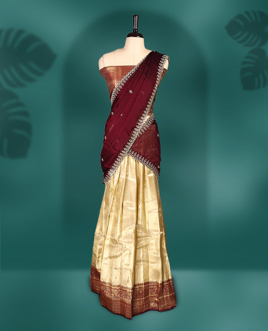 Graceful semi stitched Dhavani set featuring a deep maroon embroidered dupatta, golden zari lehenga, and matching blouse & Perfect for weddings, festivals, and traditional celebrations.