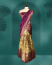 Regal semi stitched dhavani in rich maroon and antique gold silk, adorned with fine zari detailing, Ideal for festive occasions and traditional events.