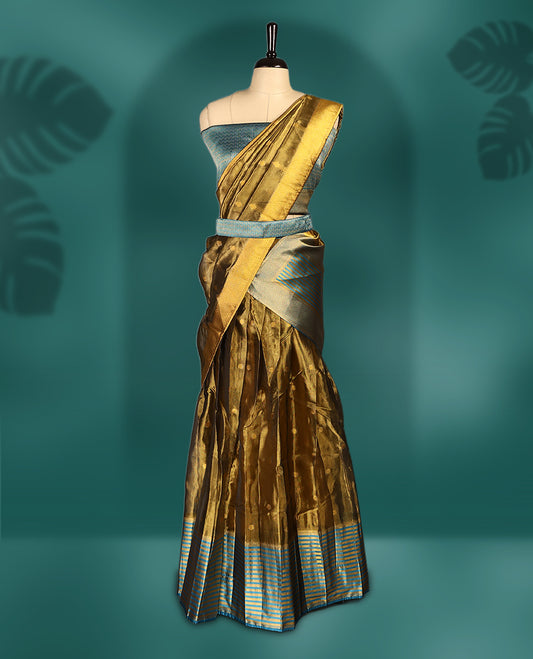 Graceful semi stitched dhavani set in golden mustard and dark aqua blue, crafted in silk with rich zari work & Perfect for festive occasions, weddings, and traditional events, Customizable for a perfect fit.