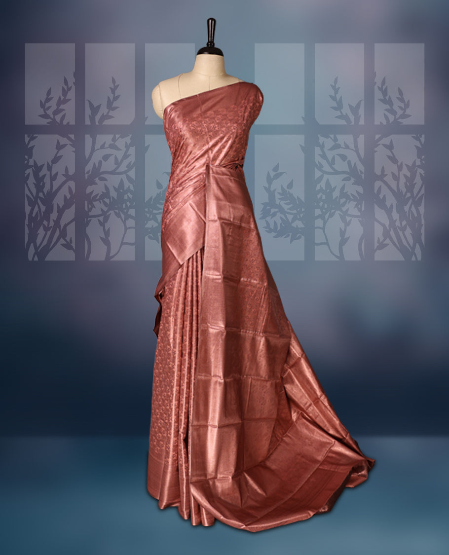 Pastel onion colour semi silk saree brocade saree featuring intricate self-design brocade patterns across the body, complemented by a rich self-colour woven border and pallu, paired with a matching blouse.