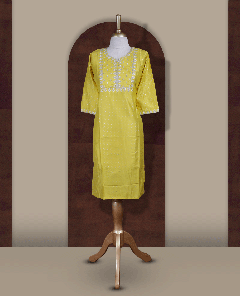Bright yellow kurthi from TWARA , adorned with delicate white embroidery, featuring a stylish V-notch neckline and comfy 3/4th sleeves.