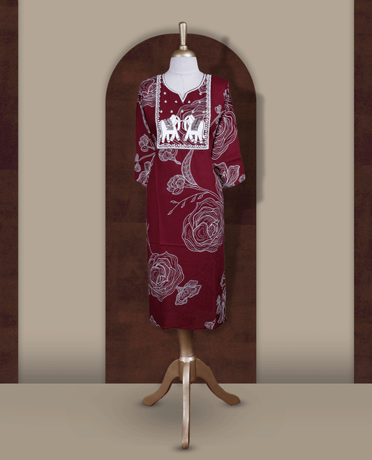 Maroon colour kurti featuring a square embroidered neck design with elephant motif patchwork, V-cut neckline, 3/4th sleeves, and floral printed body.