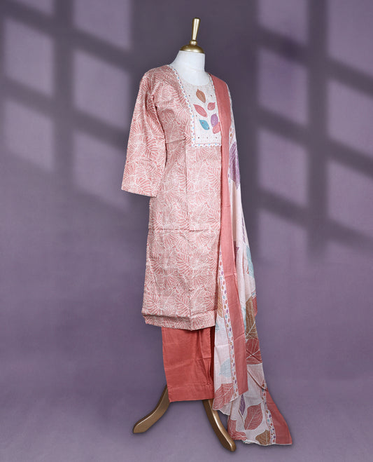 Peach brown colour cotton salwar set with round neck and elbow sleeves features multicolour leaf printed yoke and fine line floral body paired with matching plain bottom and leaf printed dupatta