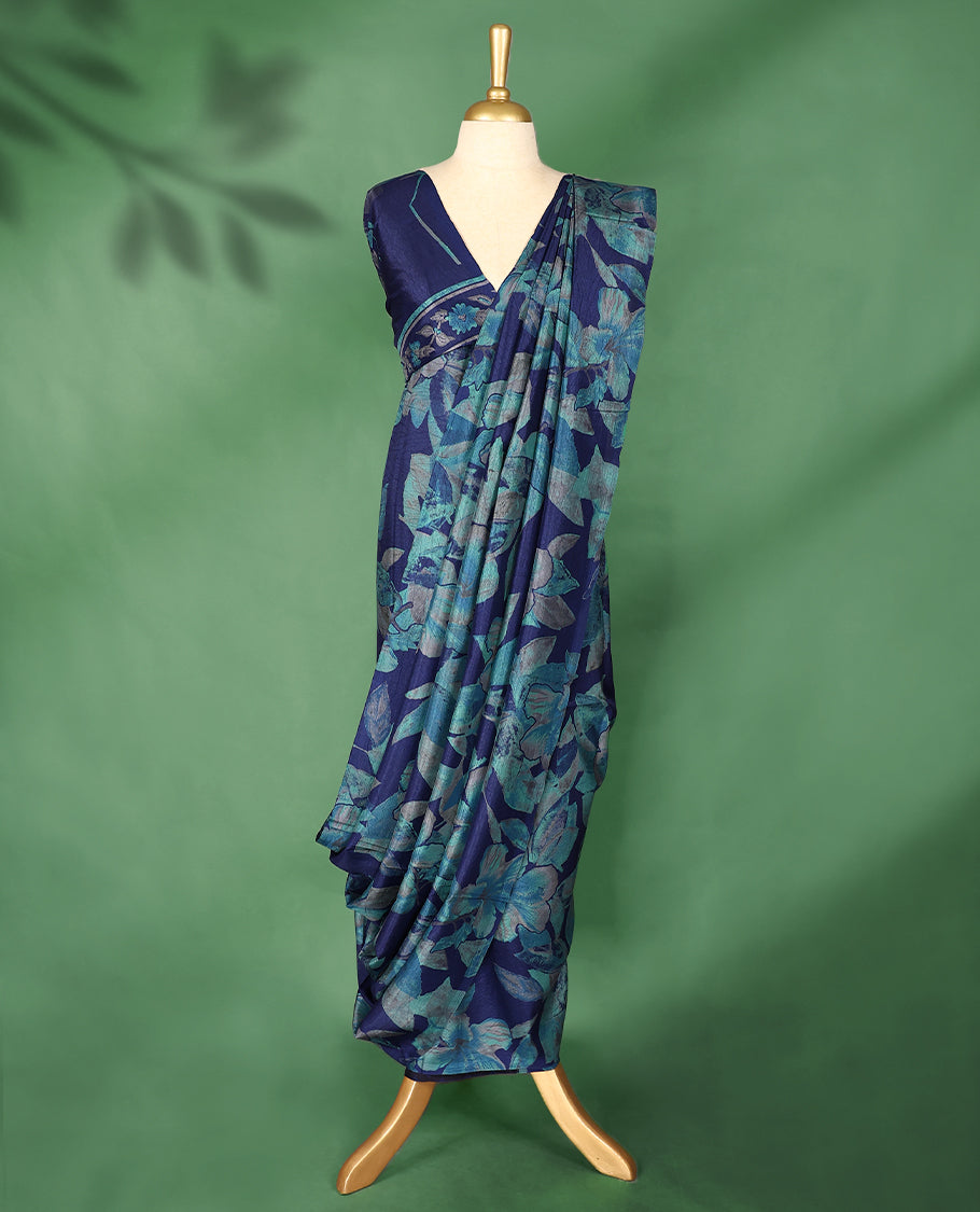 Navy blue colour Manipuri saree adorned with oversized turquoise and teal floral prints, crafted in a smooth finish with a clean, borderless silhouette and a matching blouse.