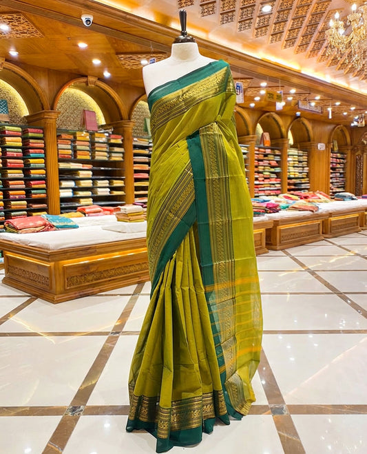 Lemon yellow with dark green dual tone colour chettinad cotton saree with traditional gold zari border without blouse piece.