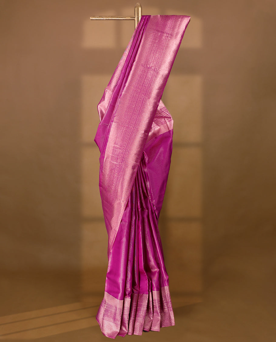 Pink Colour Manthrakodi saree featuring tissue weaving with a plain body, complemented by a self coloured traditional border and a matching self coloured blouse.