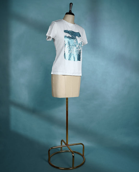 White graphic T shirt featuring a round neck and short sleeves, designed with a blue abstract print and text details for a contemporary, artistic vibe.
