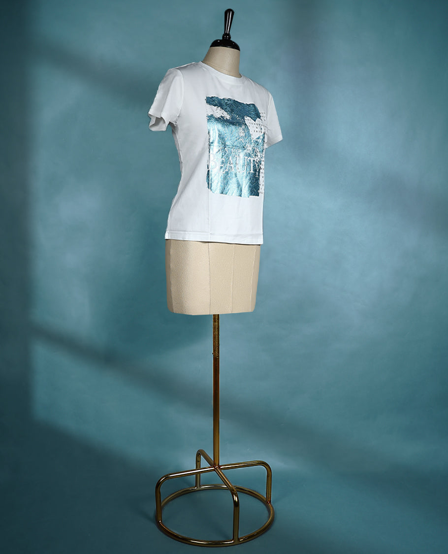 White graphic T shirt featuring a round neck and short sleeves, designed with a blue abstract print and text details for a contemporary, artistic vibe.