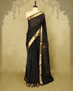 Black Colour Chanderi cotton saree featuring a subtly textured body with delicate buti work, complemented by a rich golden zari border with matching blouse