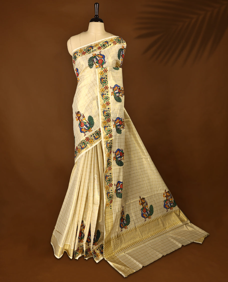 Light Gold colour Tissue Kerala saree featuring Peacock with lady print work on checked body and a beautifully woven Gold Kasavu border, paired with a matching blouse perfect for festive occasions.