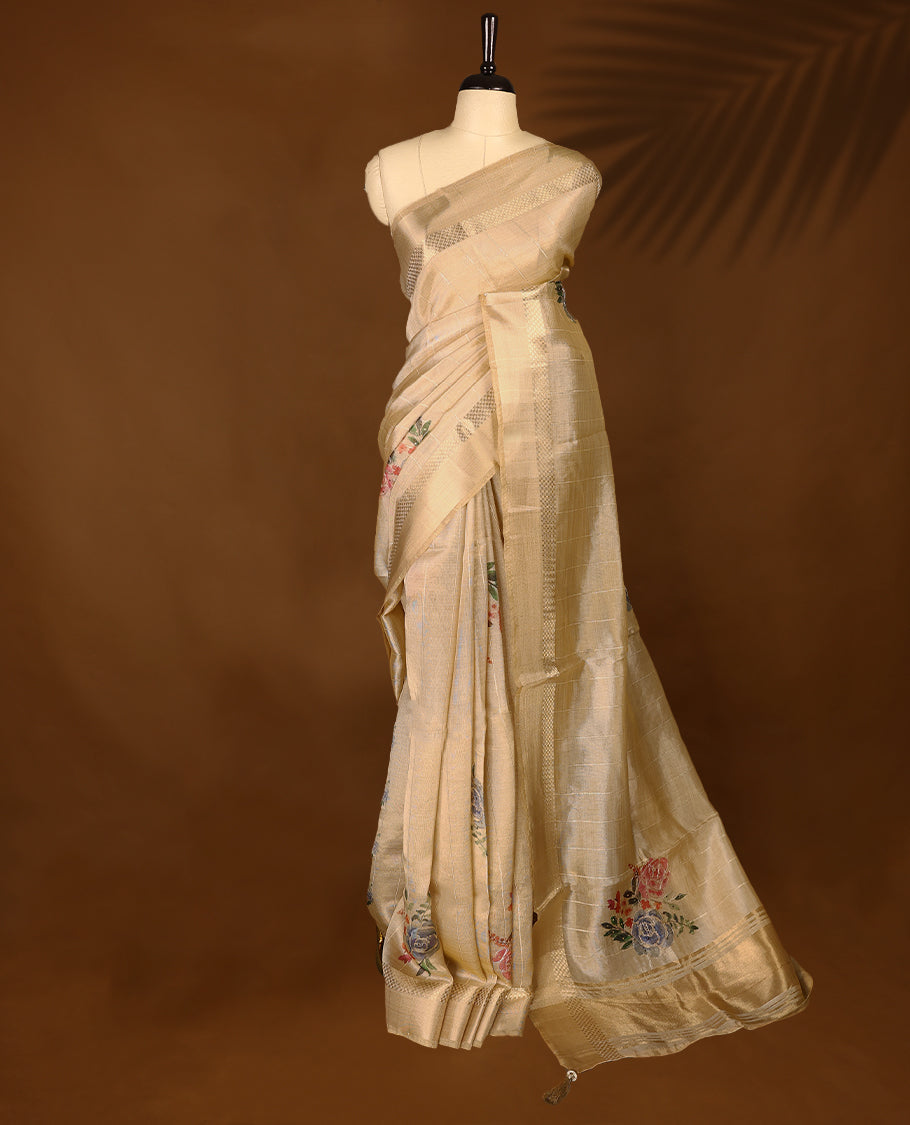 Light gold colour organza Kerala saree featuring subtle checkered weave with zari detailing on the border and pallu, highlighted with delicate floral accents near the pleats, paired with a matching blouse.
