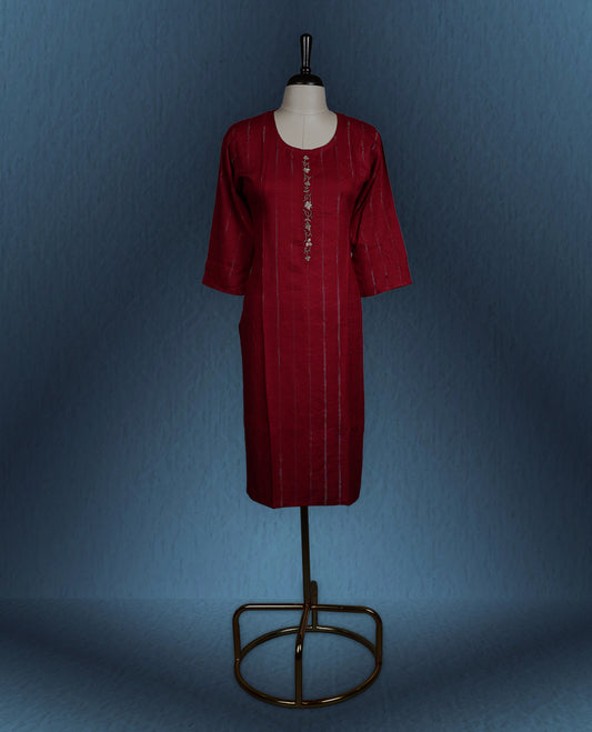 Maroon colour kurti with subtle vertical self stripes, adorned with delicate golden thread embroidery along the front placket, featuring a round neckline and stylish three quarter sleeves.