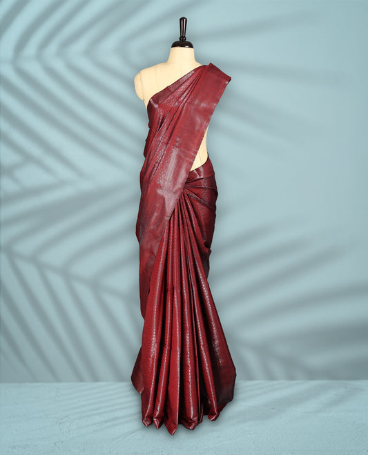 Deep Red Colour semi silk saree featuring an intricate Zari  motif weave across the body, paired with a zari worked border with matching blouse.