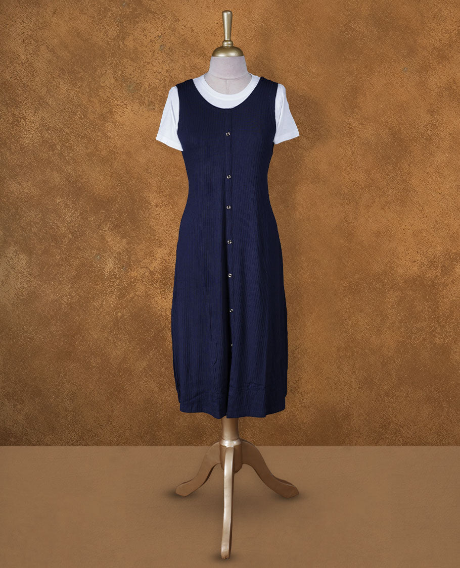 Navy blue sleeveless A-line midi dress with front button detailing, layered over a white crew-neck short-sleeve inner tee.
