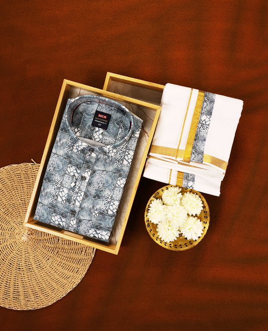 Pastel Blue colour MCR full sleeve shirt featuring all over abstract prints, paired with a white dhoti adorned with a rich golden zari kara and a matching printed border.