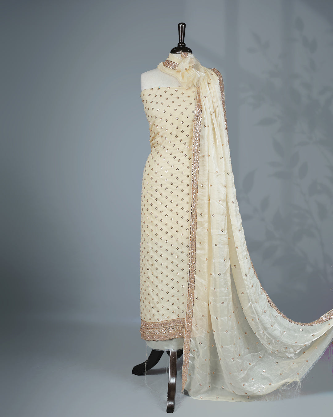 Off white colour salwar material with Cut beats & sequins work on body, Matching Bottom & dupatta.