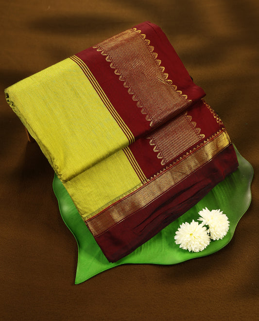 Lemon Green colour mixed Kalyani cotton saree featuring Plain body, paired with Pure Maroon colour traditional border and pallu, with matching blouse