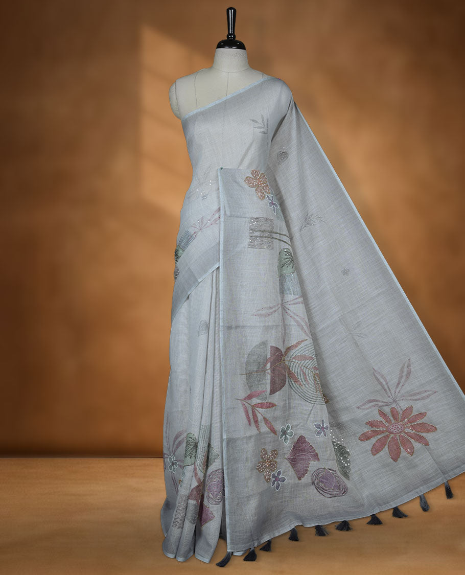 Light Grey colour Linen saree featuring Grey colour fade border with floral beats pattern around floral print across body without border, pallu and matching blouse piece.