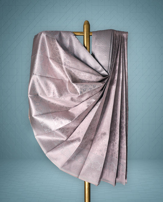 Pastel Rose Gold colour semi tissue saree featuring a brocade body, Contrast Zari Worked border, and a matching Contrast blouse.