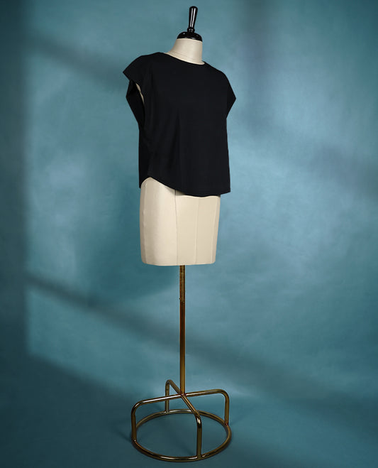 Black cap sleeve top featuring a round neck and relaxed fit, crafted from lightweight fabric for a sleek and effortless look.