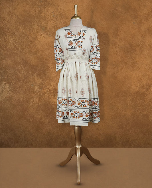 Ivory printed knee-length A-line dress with V-neckline, earthy geometric and floral motifs, three-quarter sleeves, and a detachable waist belt for a flattering fit.