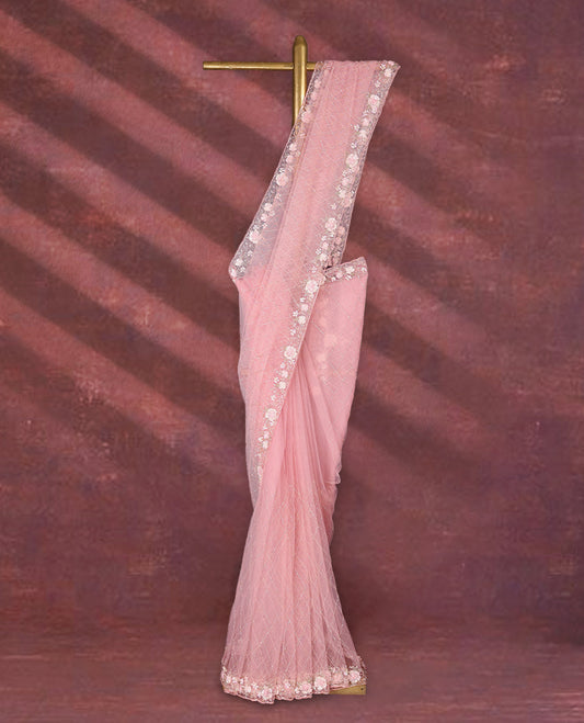 Baby Pink colour net designer saree featuring crisscross cut beads detailing on the body, adorned with beads and sequin worked floral kodi scallop border, paired with a matching worked blouse