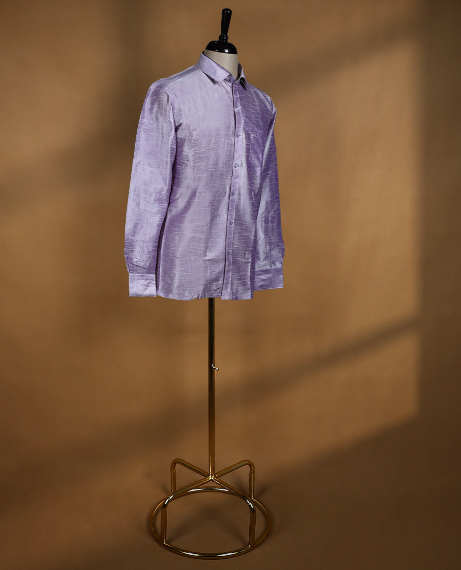 Lavender lilac colour DH men’s shirt in a relaxed formal fit featuring a lustrous semi silk finish, full sleeves, classic collar, and chest pocket ideal for festive and traditional occasions.