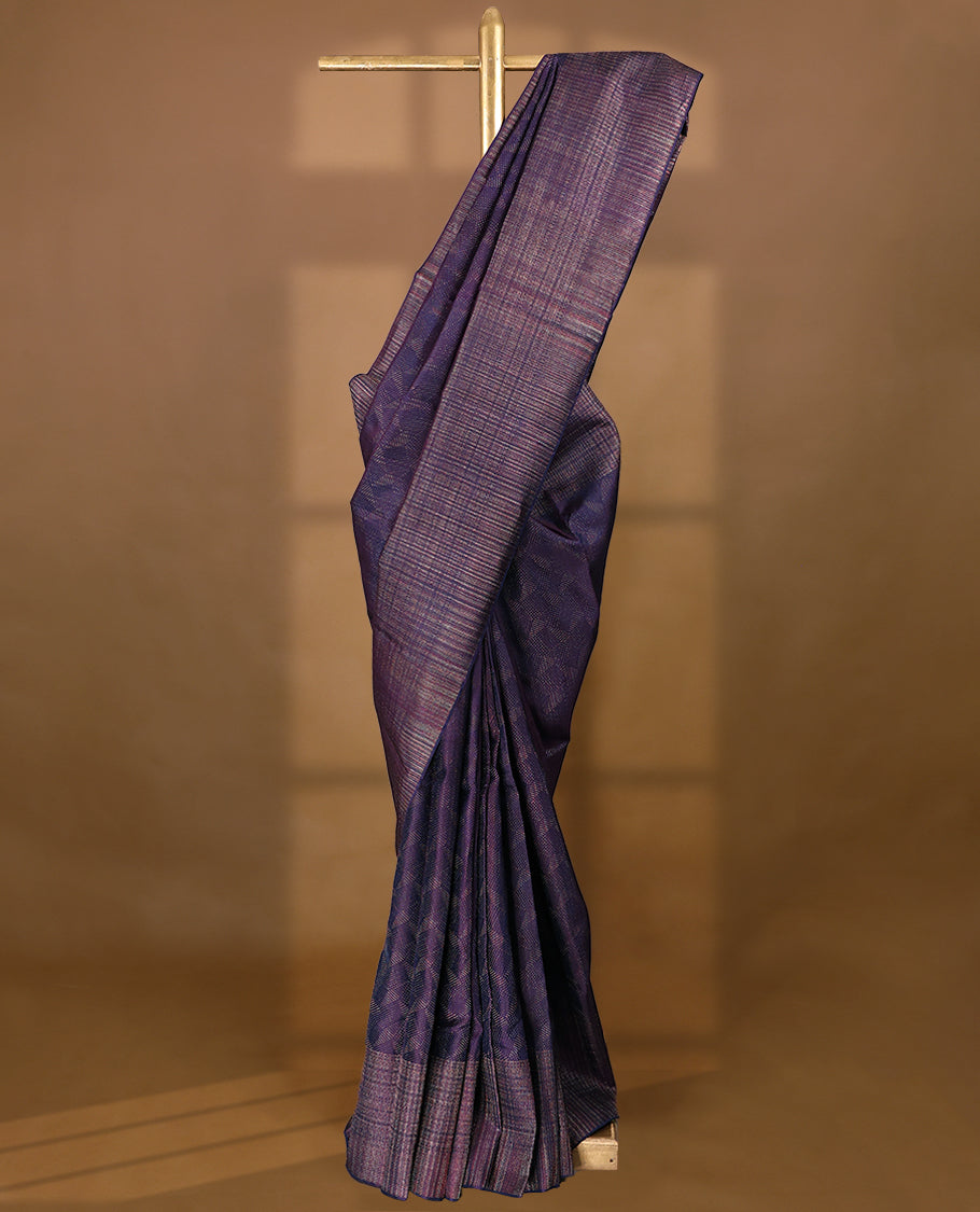Dark Royal Purple coloured Manthrakodi saree featuring a multicoloured zari jacquard body, complemented by a self coloured turning Banarasi border and a matching self coloured blouse.