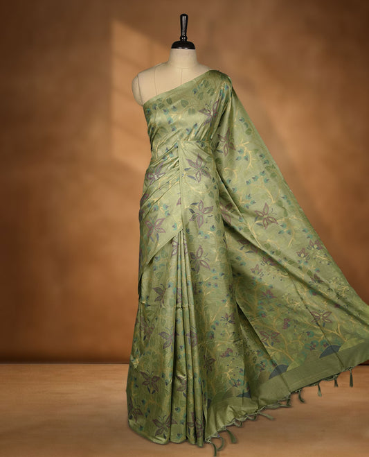 Light green colour semi jamdani tussar silk saree featuring woven Floral kodi & butterfly motifs on the body, complemented by a self colour without border pallu, paired with a matching blouse.