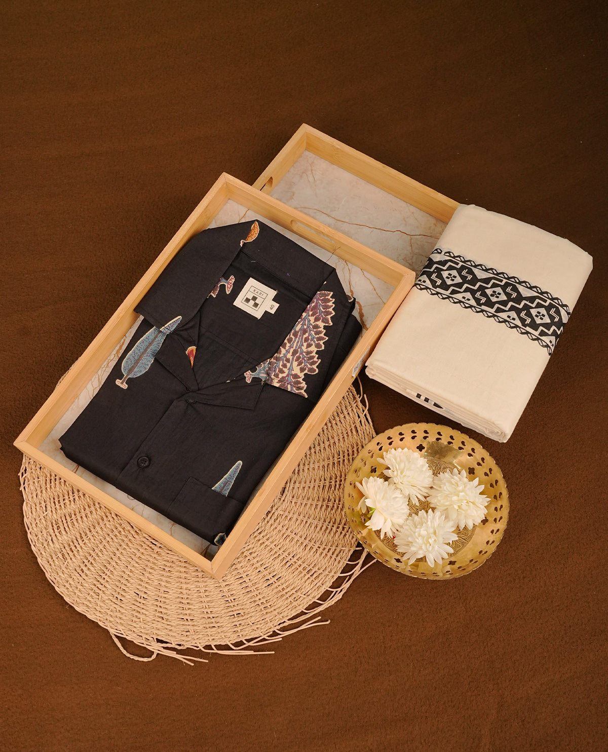 Black colour shirt featuring Floral Pattern printed body, paired with cream colour double dhoti featuring printed border.