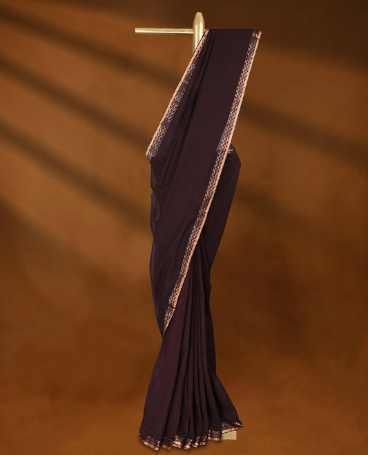 Dark chocolate colour soft khadi cotton saree with plain body, detailed woven Gold zari border, paired pallu with tussles, with matching blouse.