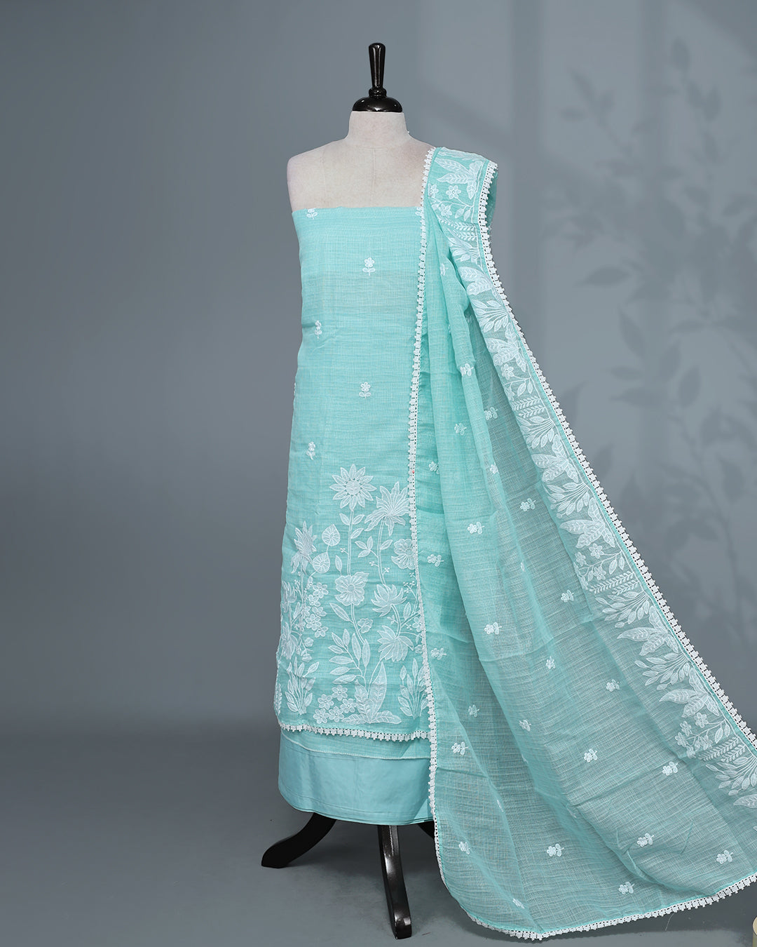 Aqua Blue Colour Kotta Net Salwar Material featuring elegant white floral thread embroidery on the kurta, paired with a matching bottom and a beautifully embroidered dupatta.